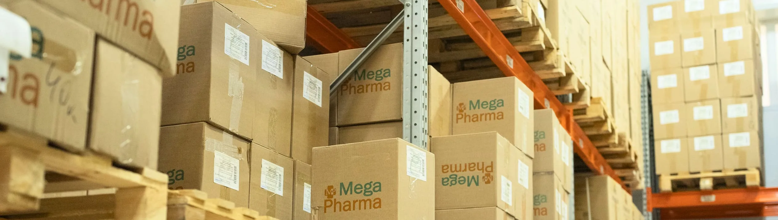 Фирменные коробки Mega Pharma на складских стеллажах